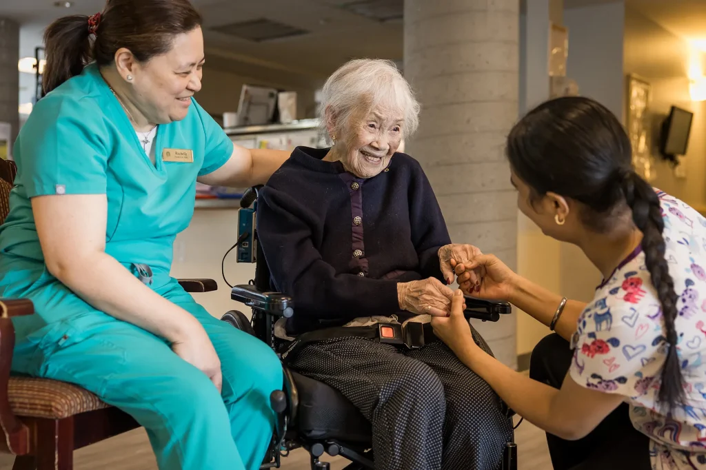 Wing Kei resident with staff