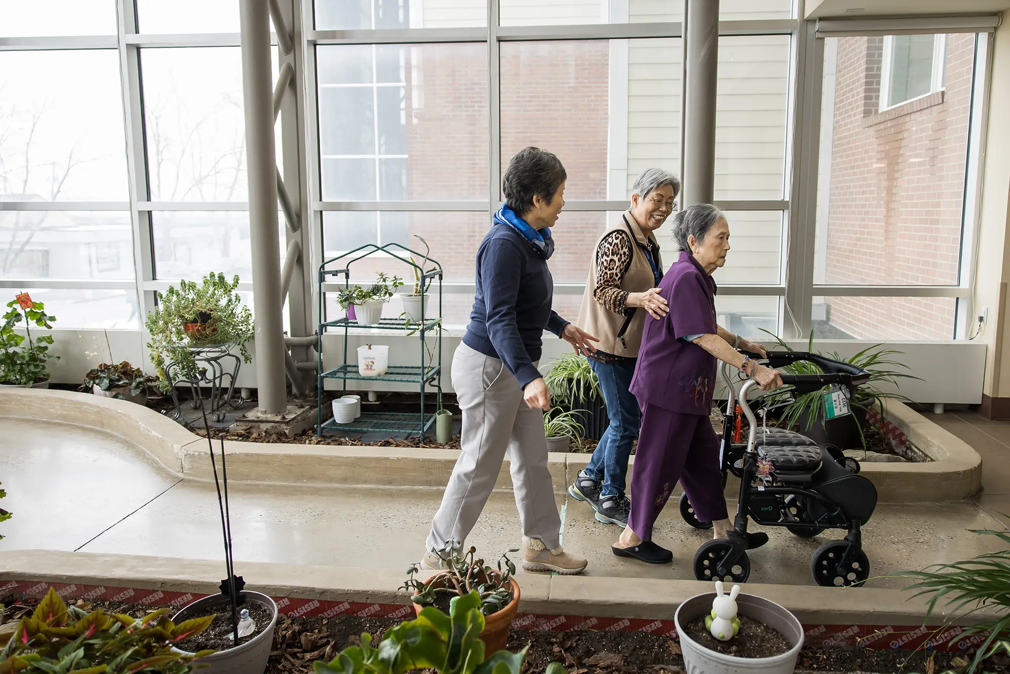 Wing Kei Greenview resident and family walking